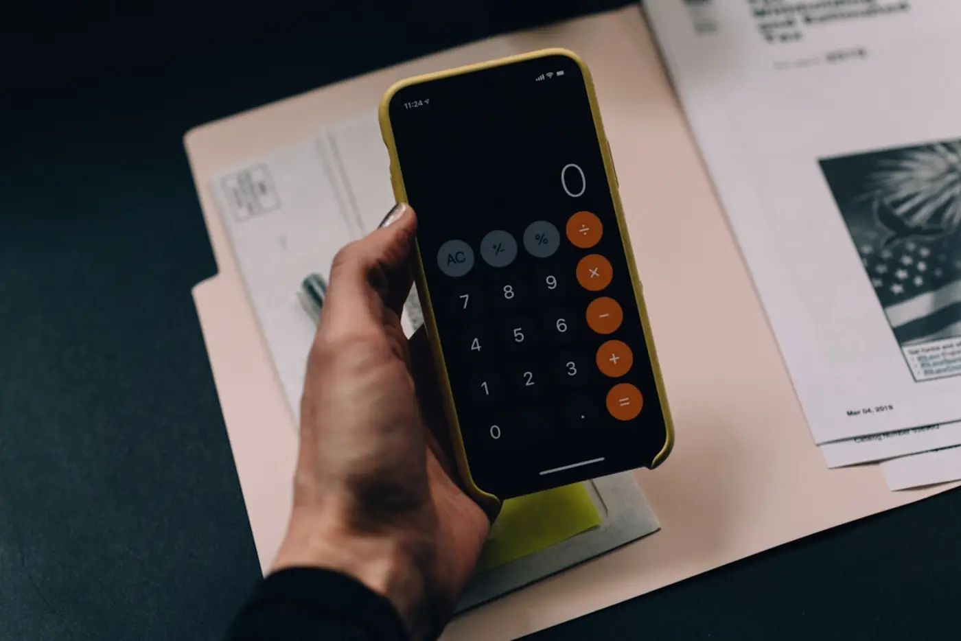 A person building credit with a secured card and a phone