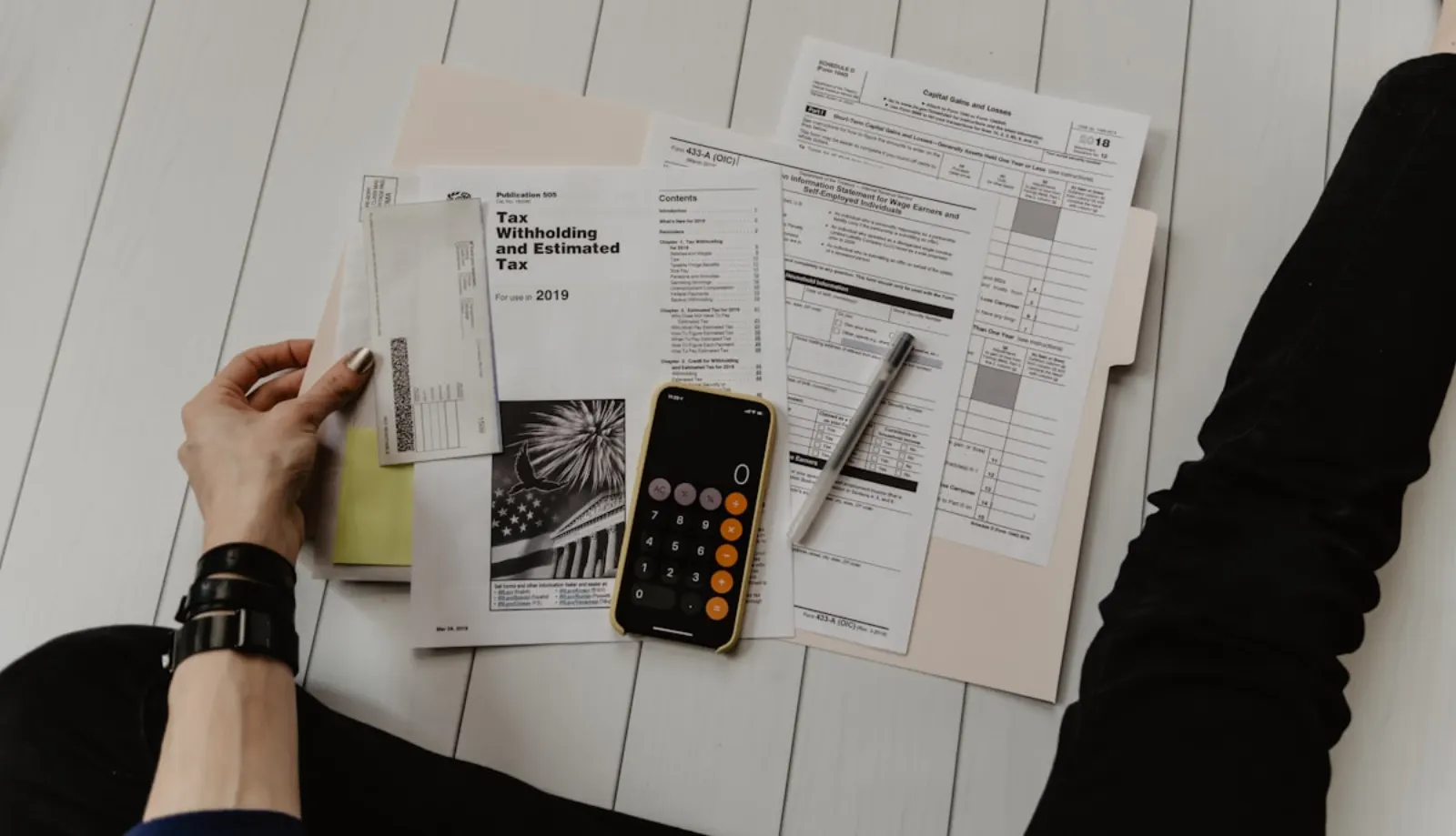 IRS Form W-7 and ITIN paperwork on a desk